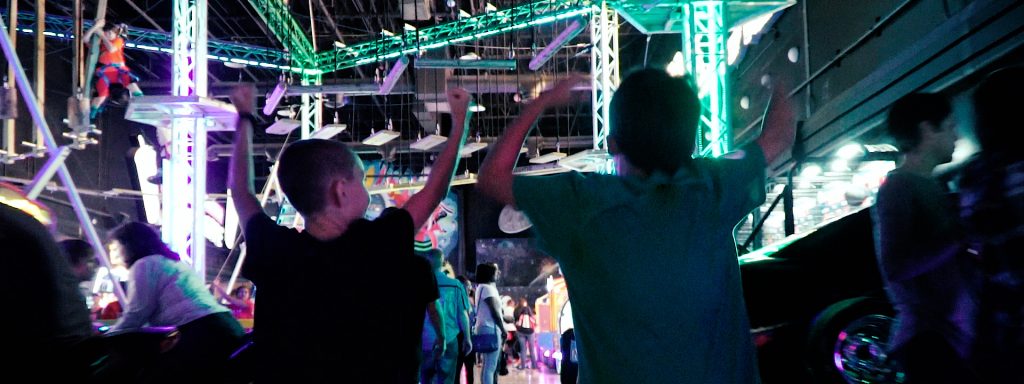 Camp kids running in arcade